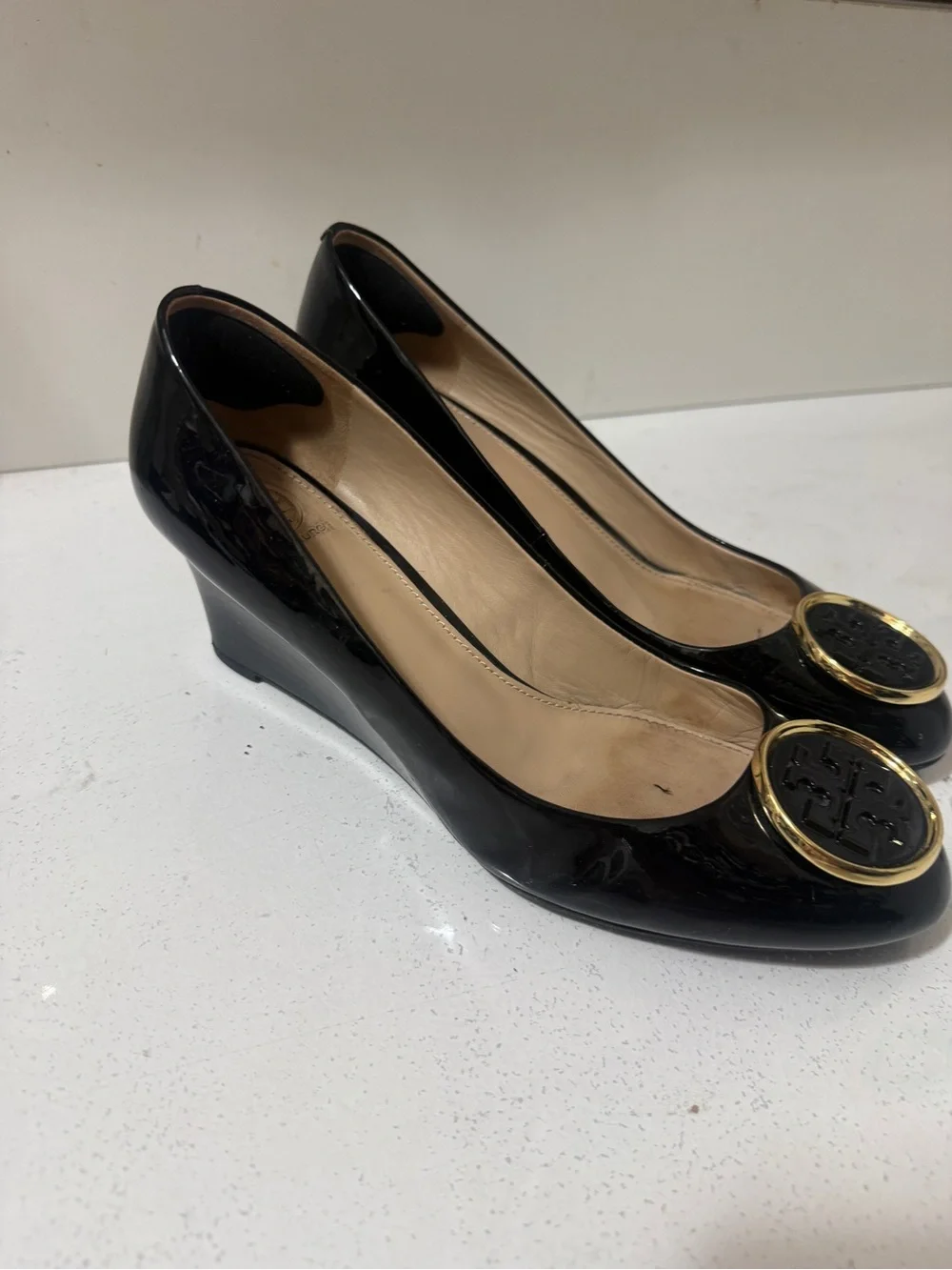 Tory Burch Black Patent Leather Wedge Flats with Gold Logo Medallions